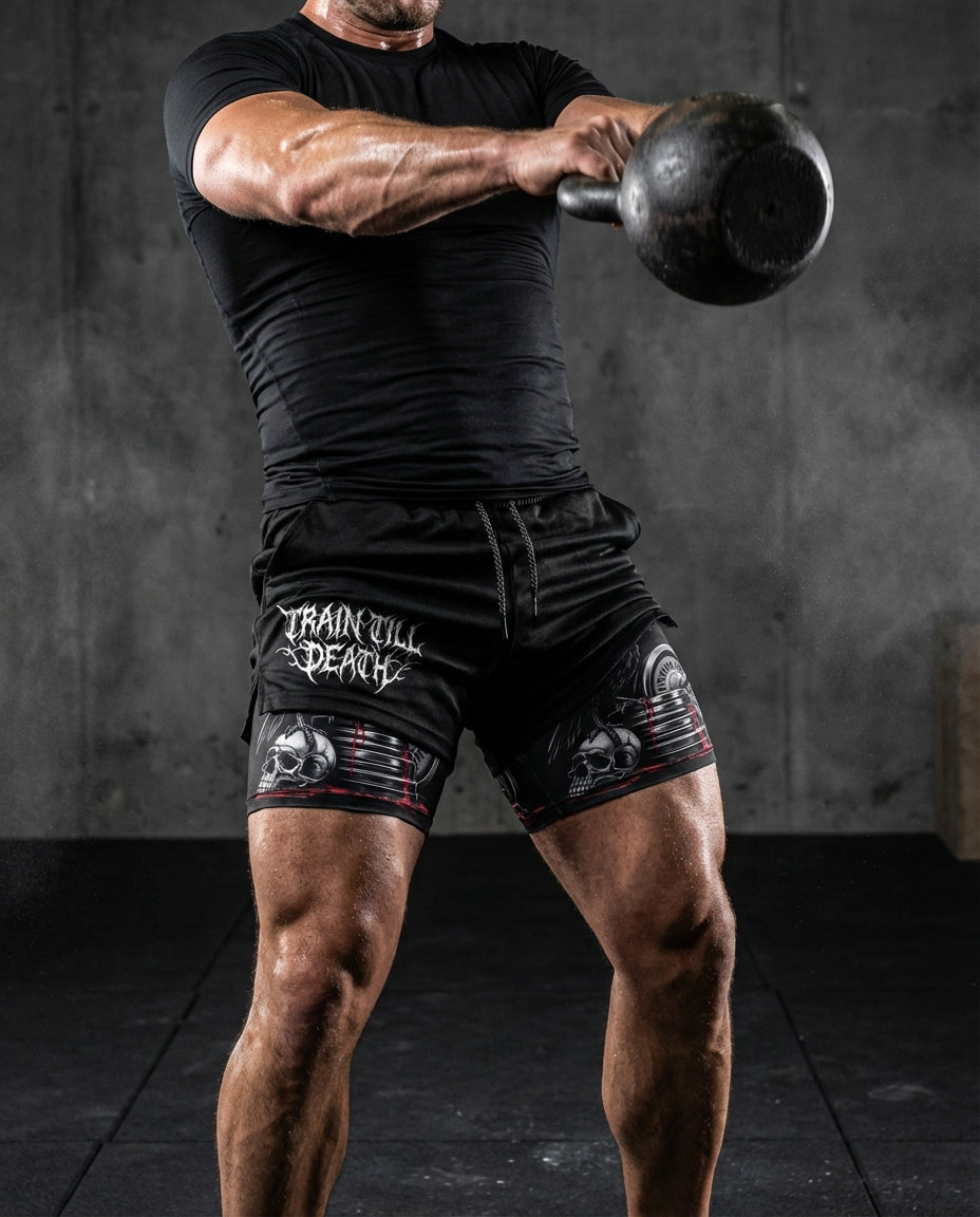 Person lifting a kettlebell wearing black athletic shorts with 'Train Will Death' text.